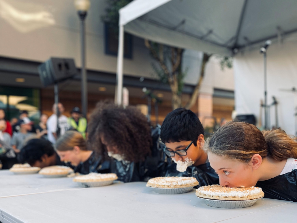 Kids in a pie eating contest in Bethany Village, Portland, Oregon